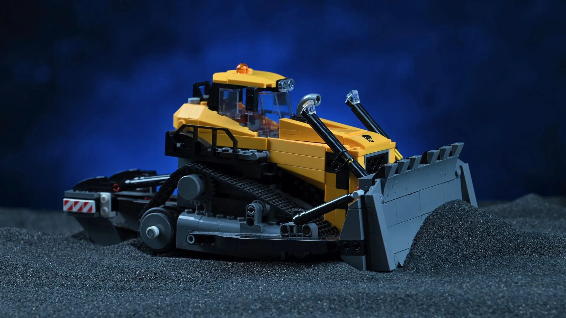 LEGO City Yellow Bulldozer (60466): the excavator's new construction-site partner The finished LEGO City Yellow Bulldozer (60466), showing its tracked chassis, raised pusher blade and cab, staged against a dark blue backdrop