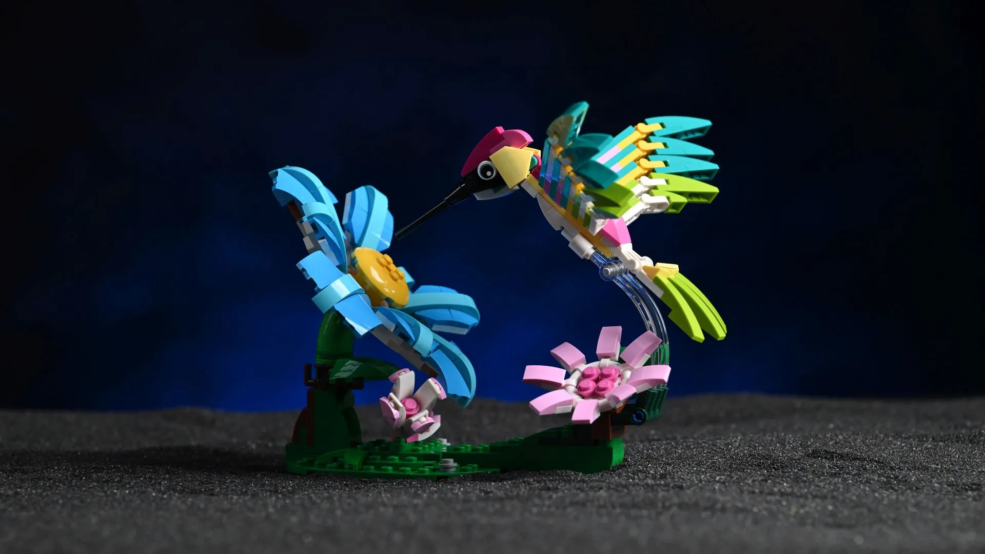LEGO Creator 3-in-1 Colorful Hummingbird (31384) The LEGO Creator 3-in-1 Wild Animals: Colorful Hummingbird (31384) in its dynamic flying pose, hovering over its brick-built flower stand