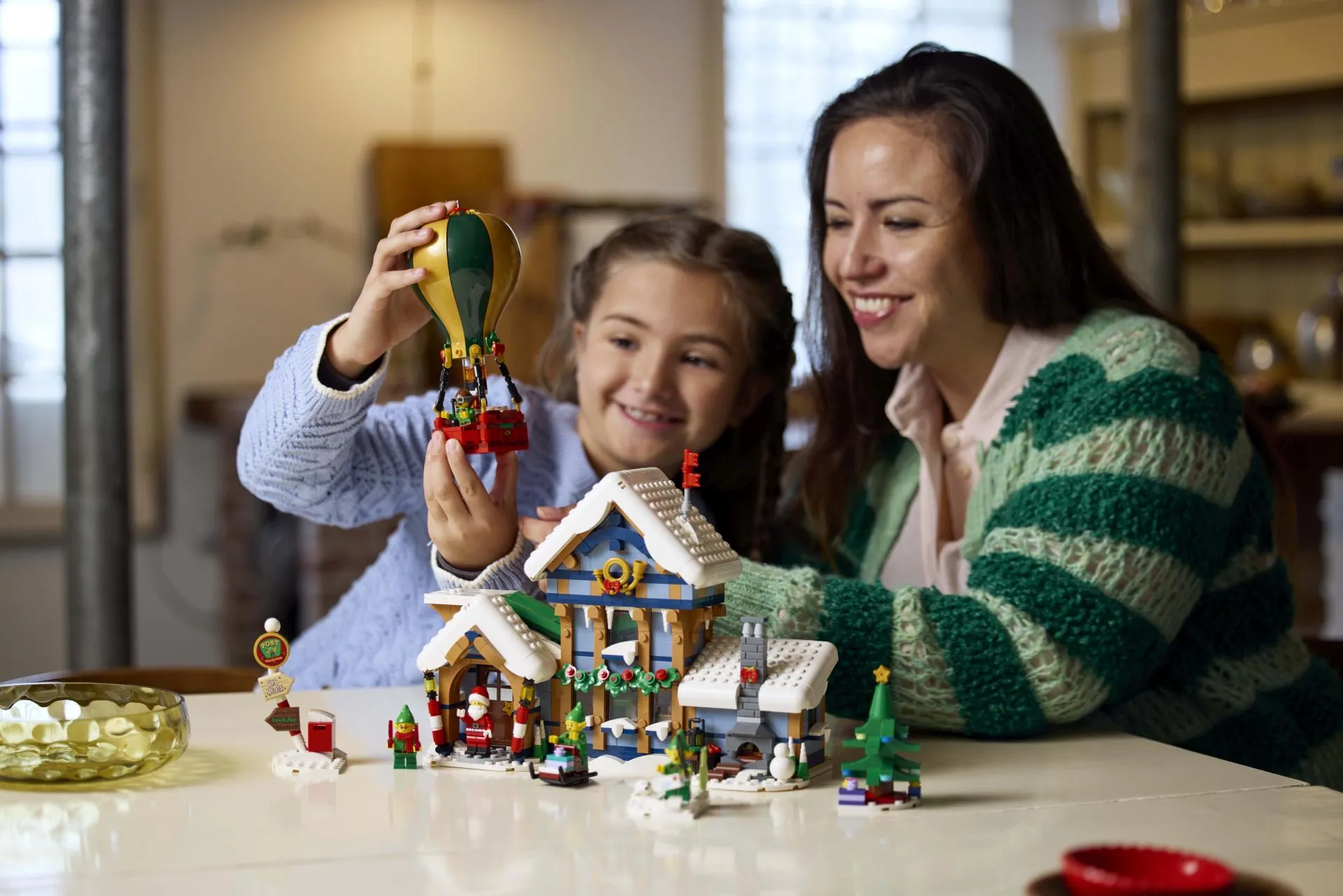 LEGO Star Wars: The Mandalorian - the whole couch, one special A family building a LEGO set together on the living room floor - official LEGO lifestyle photo