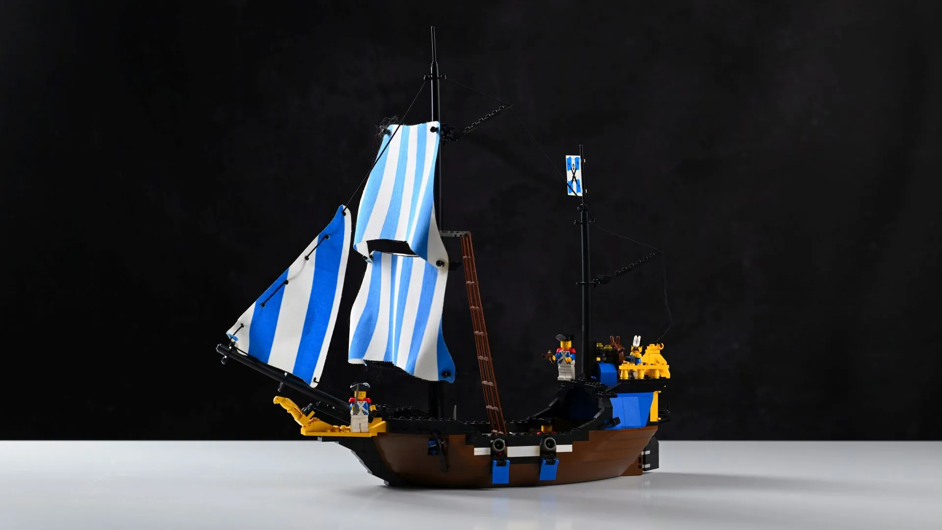 LEGO Pirates Caribbean Clipper (6274): 37 years and still seaworthy The complete LEGO Pirates Caribbean Clipper (6274) set from 1989, fully built after 37 years, with its blue-striped sails, twin cannons, and Imperial Soldier crew